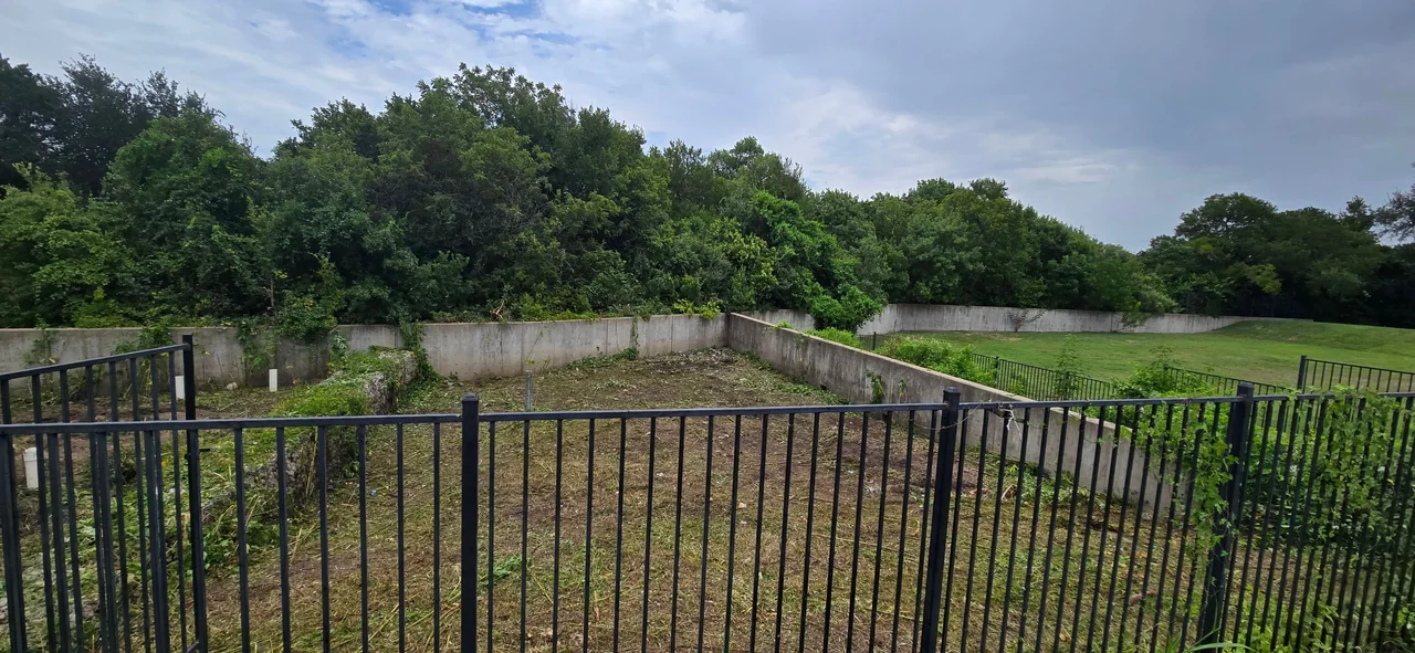 Detention basin after vegetation clearing.